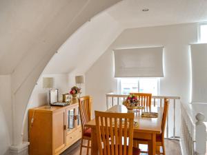 a dining room with a table and chairs at The Old School in Cleethorpes