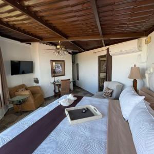a living room with a large bed and a couch at Luxury Villa Retreat - 8 Bedrooms - Sleeps 20 in San Miguel de Allende +81 photos