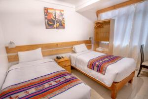Ein Bett oder Betten in einem Zimmer der Unterkunft Vista Machu Picchu