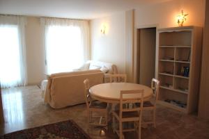 a living room with a table and a couch at Casa Camilla City in Padova