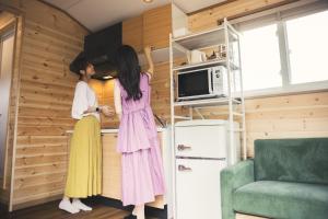 two women are standing in a small kitchen at cottage - Vacation STAY 02033v in Shinano