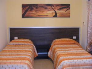 Postel nebo postele na pokoji v ubytování B&B FreeZone
