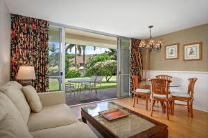 a living room with a couch and a table at Aston Maui Kaanapali Villas in Lahaina