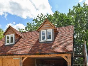 a house with two windows on top of it at Hazel Nook in Trotton