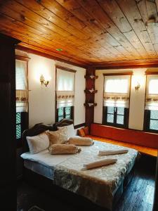 a bedroom with a bed with pillows on it at Asya konak in Safranbolu