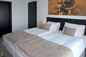 Voodi või voodid majutusasutuse Hotel Mousson toas