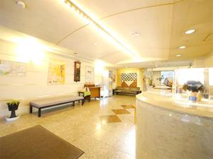 a large lobby with a couch and a waiting room at Hotel Fukui Castle - Vacation STAY 58699v in Fukui