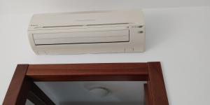 a toaster oven sitting on top of a cabinet at Villa4Holydays - M1 subway in Milan