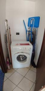 a washer and dryer in a corner of a room at Villa4Holydays - M1 subway in Milan