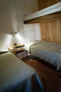 Giường trong phòng chung tại Cabañas Ranco Lauken