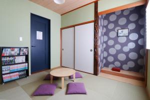 a room with a table and a book shelf at HAKATA TERRACE -Toki- - Vacation STAY 14934 in Fukuoka