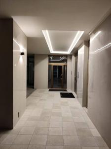 a hallway of an office building with a tile floor at Casa Dante in Galatina