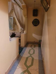 a hallway with a cat laying on the floor at khenifra in Khenifra