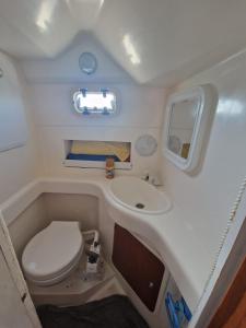 a small bathroom with a toilet and a sink at SAMMY SEA in Sitges