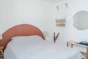 Llit o llits en una habitació de Charmant T2 avec balcon - Chaves
