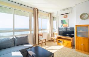 a living room with a couch and a flat screen tv at Awesome Apartment In Málaga in Málaga