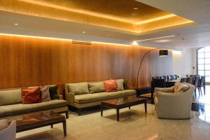 a waiting room with couches and chairs and a table at Marriott Buenos Aires Downtown in Buenos Aires