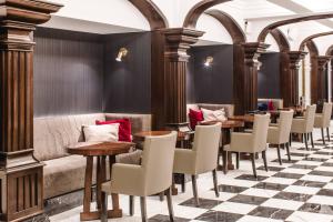 a row of tables and chairs in a restaurant at Marriott Buenos Aires Downtown in Buenos Aires