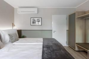 Postel nebo postele na pokoji v ubytování Living Ascona Boutique Hotel
