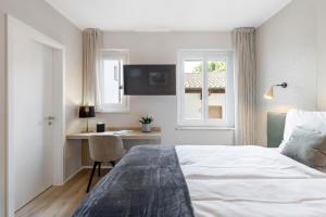 Postel nebo postele na pokoji v ubytování Living Ascona Boutique Hotel