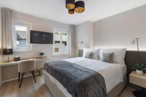 Postel nebo postele na pokoji v ubytování Living Ascona Boutique Hotel
