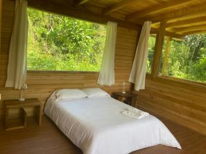 Postel nebo postele na pokoji v ubytování La Providencia Lodge