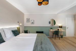 Postel nebo postele na pokoji v ubytování Living Ascona Boutique Hotel
