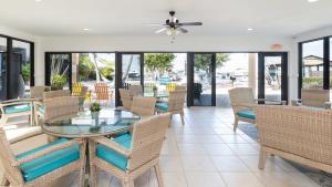 a dining room with a glass table and chairs at B 405 Moon Bay in Key Largo
