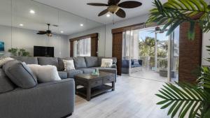 a living room with a couch and a ceiling fan at 409 Mariners Club in Key Largo