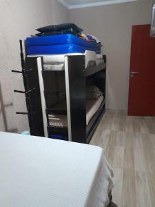 a group of bunk beds in a room at Praia Grande canto do forte in Praia Grande