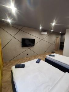 LOFT HOUSE APARTMENTS客房内的一张或多张床位