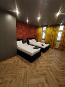 LOFT HOUSE APARTMENTS客房内的一张或多张床位