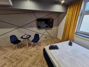LOFT HOUSE APARTMENTS的电视和/或娱乐中心