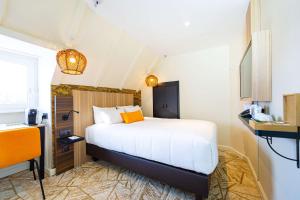 Postel nebo postele na pokoji v ubytování Best Western Mulhouse Salvator Centre