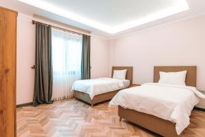 A bed or beds in a room at Kartal Konağı