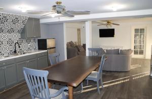 a kitchen and living room with a wooden table and chairs at Mountain View Studio in Hemet