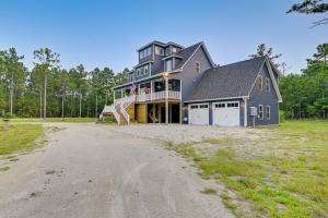a large gray house with a gambrel at Expansive Georgetown Home with Decks and Fire Pit! in Georgetown