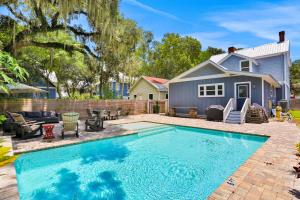 a swimming pool in the backyard of a house at Sanford Serenity in St. Augustine