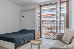 Posteľ alebo postele v izbe v ubytovaní Appartement cosy avec balcon