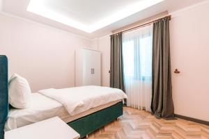 A bed or beds in a room at Kartal Konağı