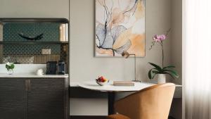 a table and a chair in a room at InterContinental Bangkok by IHG in Bangkok
