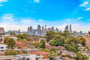 a view of the sydney city skyline with buildings at Stunning City and Water View Apartment in Sydney