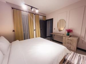 A bed or beds in a room at Kartal Konağı