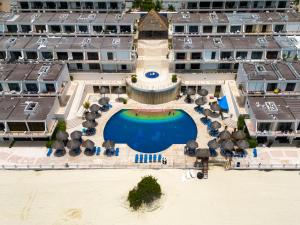 an aerial view of a resort with a swimming pool at Family Vacations apartment Ocean View in Cancún