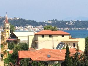 a view of a city with buildings and a church at Athina Studios in Argasi