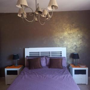 En eller flere senge i et værelse på Casa Rural del Saz