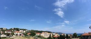 a group of houses on top of a hill at Athina Studios in Argasi