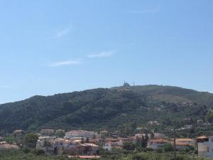 a town on top of a hill with houses at Athina Studios in Argasi