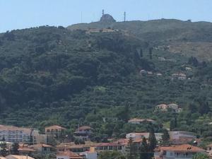 a view of a mountain with houses and buildings at Athina Studios in Argasi