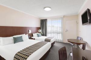 BreakFree Queanbeyan客房内的一张或多张床位